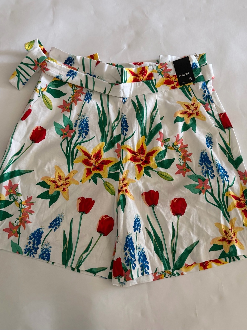 New York & Company White Floral Tie-Waist Shorts with Red, Yellow & Blue Flowers